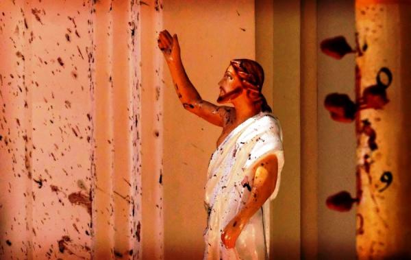 This photo taken at St. Sebastian's Church in Negombo is a snapshot of the horror that many experienced during this holy weekend. Blood stains are splattered across the walls and on a statue of Jesus Christ..jpg