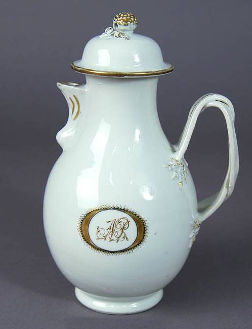 Pear-shaped jug with lip, laced handle fastened to body with molded berries and leaves,.jpg
