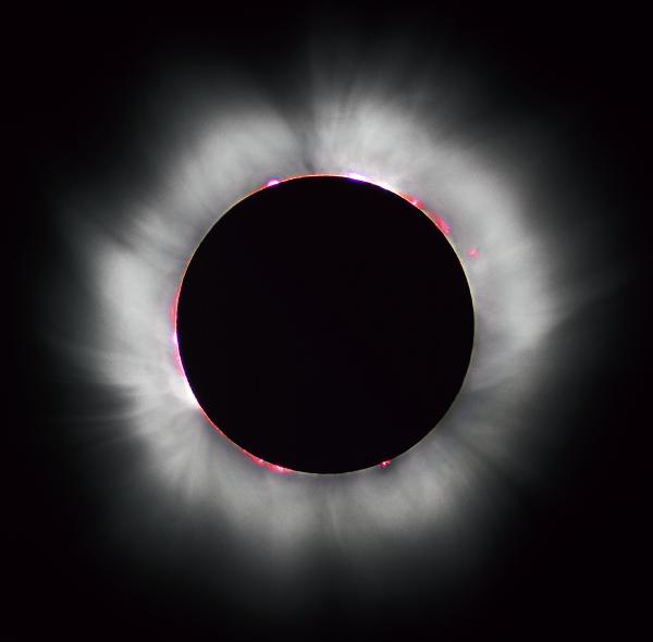 During a total solar eclipse, the Sun's corona and prominences are visible to the naked eye.jpg
