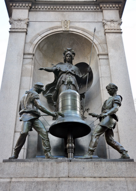 2024-03-10_Herald Sq Plaza_James Gordon Bennett Memorial_Goddess of Wisdom_ Minerva w Her Owls in Front of a Bell_ Flanked by 2 Bell Ringers Mounted on a Milford Pink Granite Pedestal0001.JPG