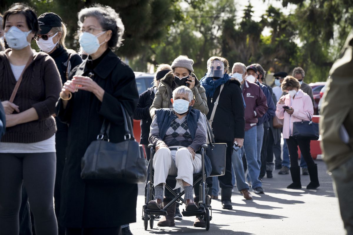 People standing in line to get vaccinated.