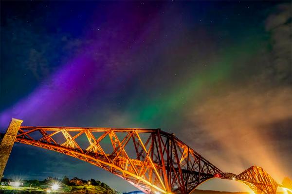 56The aurora borealis is seen above the Forth Bridge at North Queensferry, Scotland, on Friday night.jpg