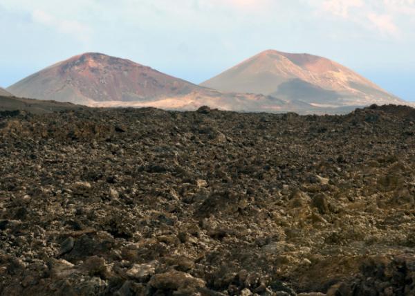 2024-06-08_30_Timanfaya NP w the Original Caldera on the R & the Mountain of Pyroclasts on the L0001.JPG