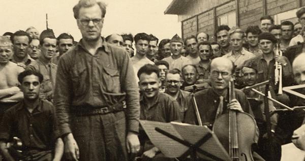 Jean le Boulaire, Olivier Messiaen (standing), Henri Akoka, and Étienne Pasquier with prisoners and.jpg