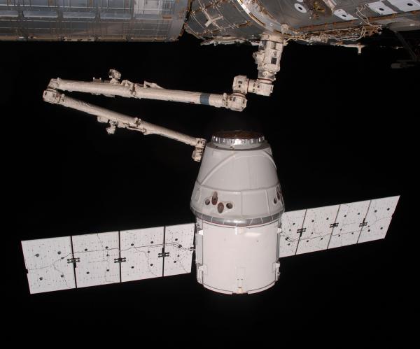 The COTS 2 Dragon is berthed to the International Space Station (ISS) by Canadarm2.jpg