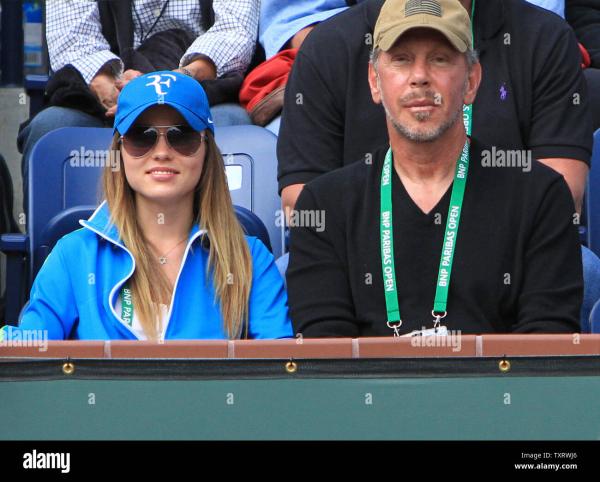 oracle-ceo-and-tournament-owner-larry-ellison-and-guest-watch-the-mens-final-match-between-american-john-isner-and-roger-federer-of-switzerland-at-the-bnp-paribas-open-in-indian-wells-california-on-march-18-2012-federer-defeated-isner-7-6-7.jpg