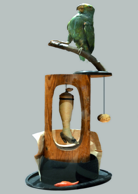 2024-10-19_118_Joan Mir Object 1936 Stuffed Parrot on Wood Perch_ Stuffed Silk Stocking w Velvet Garter & Doll's Paper Shoe Suspended in Hollow Wood Frame_ Derby Hat_ Hanging Cork Ball...0001.JPG