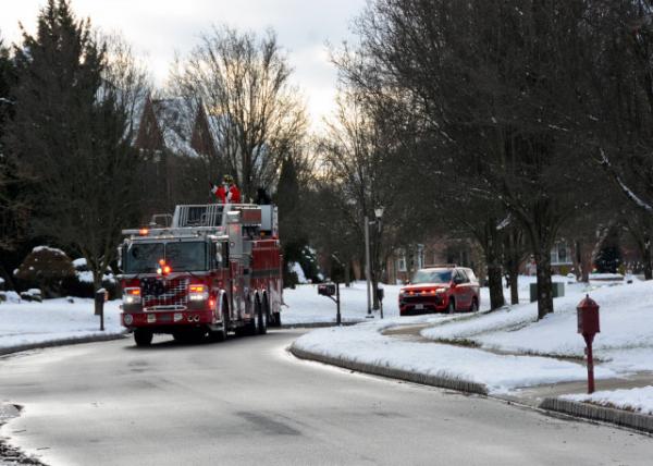 2024-12-21_06_Santa Claus Transported throughout the Neighborhoods of Montgomery Twp on a Fire Truck0001.JPG