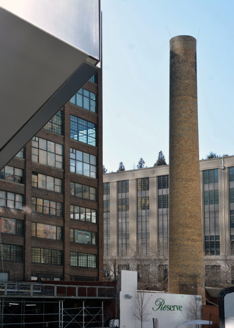 2025-02-22_06_Traditional Brick Industrial Bldg in Chelsea Neighborhood w Large Chimney or Smokestack in Front & Modern Skyscraper in Background0001.JPG