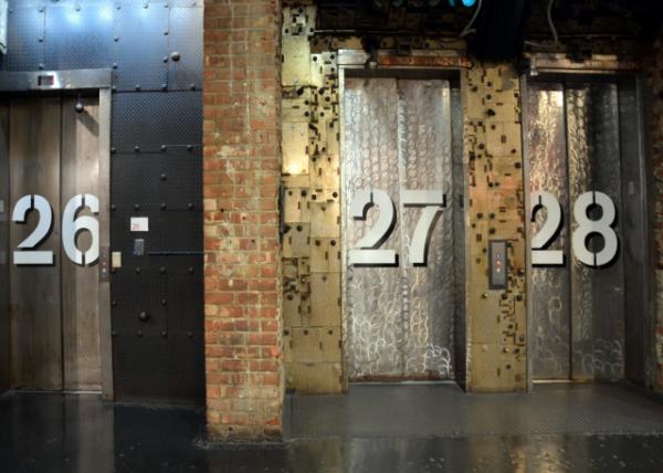 2025-03-15_23_A Large Metal Elevator Door w Numbers on it &  a Close-up View of Nos 27-28 w Ornate_ Patterned_ Gold-Colored Metal0001.JPG