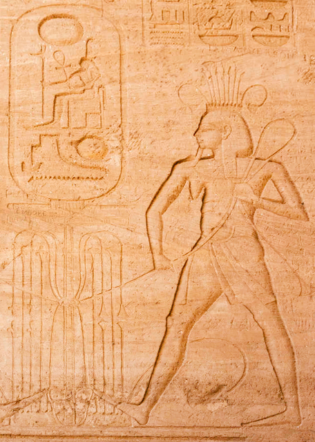 04-06-11_ Frieze outside Great Temple w Its 4 Iconic 20-Meter Tall Seated Colossal Statues of Ramses II (Ramses The Great).jpg