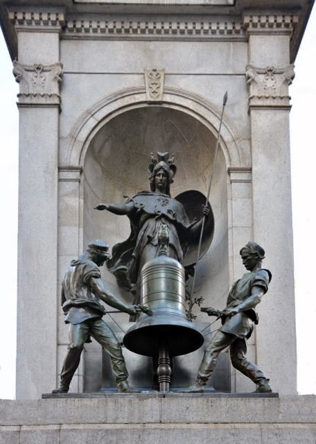 2024-03-10_Herald Sq Plaza_James Gordon Bennett Memorial_Goddess of Wisdom_ Minerva w Her Owls in Front of a Bell_ Flanked by 2 Bell Ringers Mounted on a Milford Pink Granite Pedestal0001.JPG