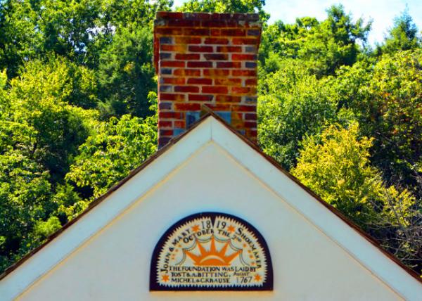 2022-08-14_Sunrise Mill Sign bears the initials of owners Jacob and Mary Shoemaker above the bay door from that era0001.JPG