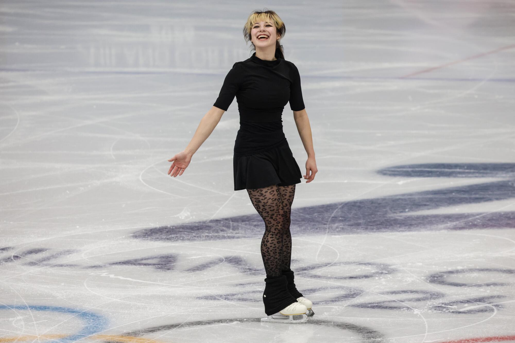 U.S. figure skater Alysa Liu smiles while taking part in a training session Thursday in Milan.