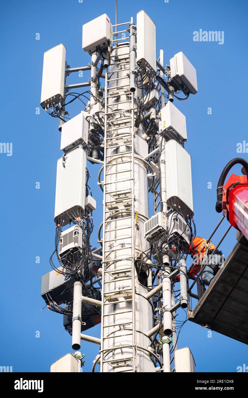 5G deployment in France: installation of mobile phones relay stations with  an aerial work platform. Technicians at work. French phone and Internet pro  Stock Photo - Alamy