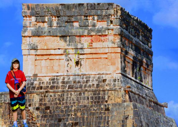 16_2014-11-03_Temples of the Jaguar_The Upper Temple of the Jaguar Overlooking the Ball Court & an Entrance Guarded by 2 Large Columns Carved in the Familiar Feathered Serpe-10001.jpg